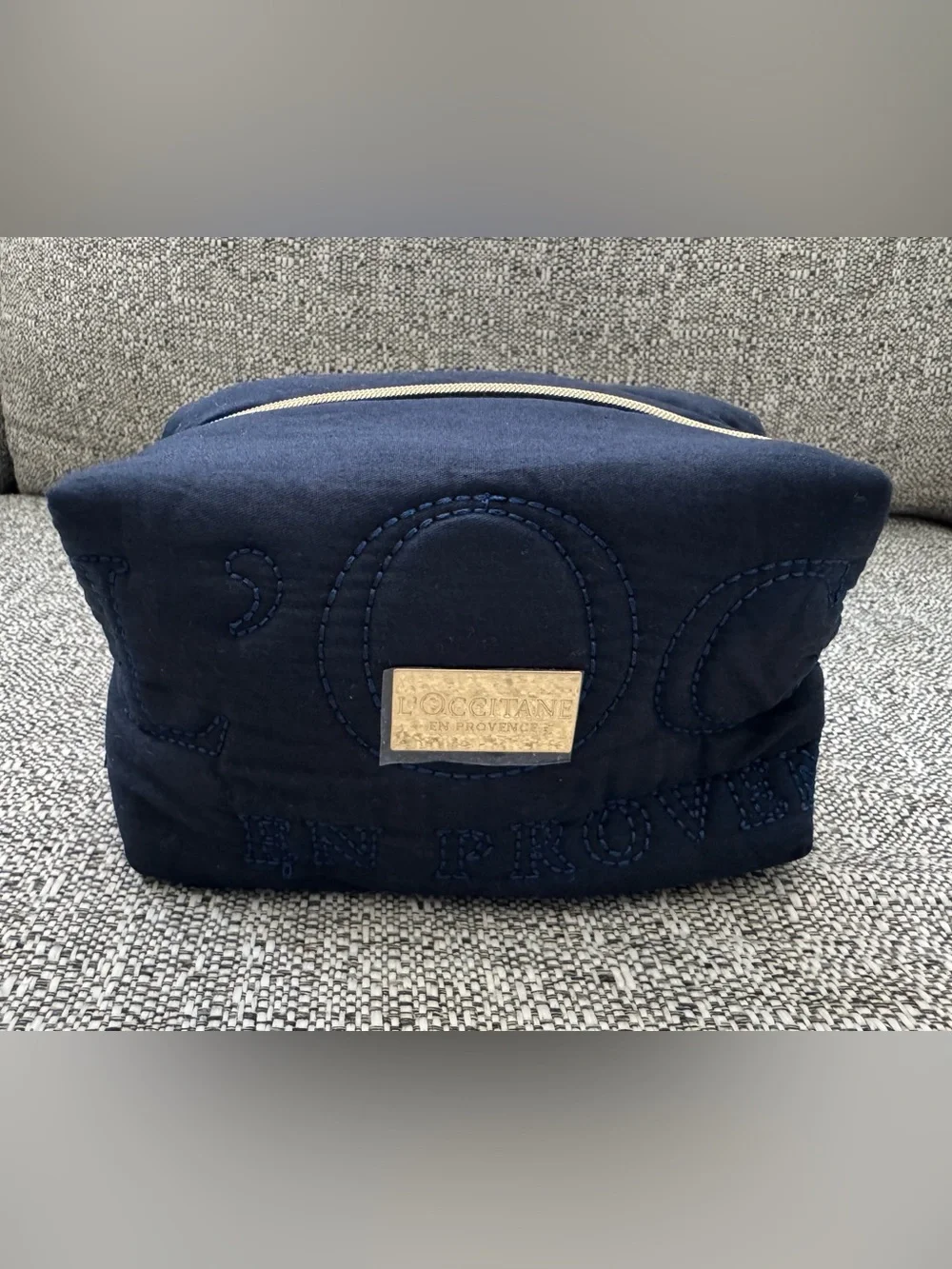 L'OCCITANE Navy Quilted Cosmetic Clutch with Gold Plaque